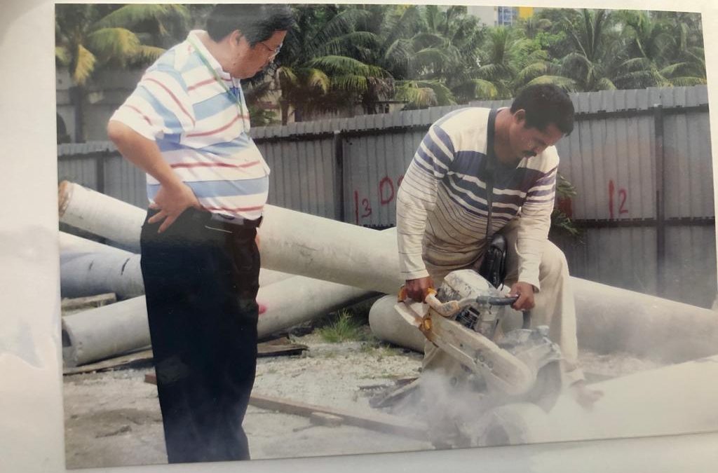 Founder Ricky Lim of GL BOSUN DIAMOND TOOLS (M) SDN BHD observing product performance in photos